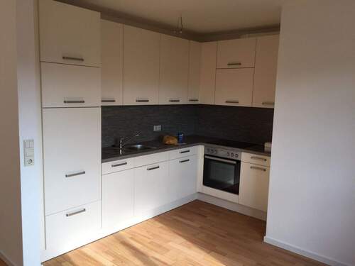 Die geschmackvolle Einbauküche der Wohnung - 