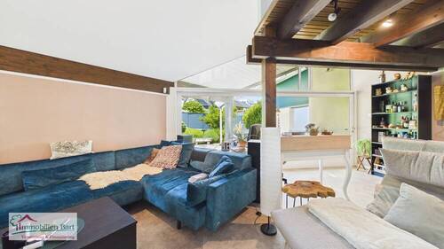 Wohnzimmer mit Zugang zur Terrasse - 
