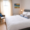 Schlafzimmer mit Zugang zum Balkon - 