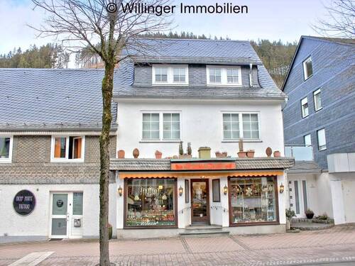 . Ansicht - Mehrfamilienhaus mit Geschäften