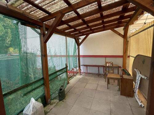 Terrasse mit Zugang in den Garten - 