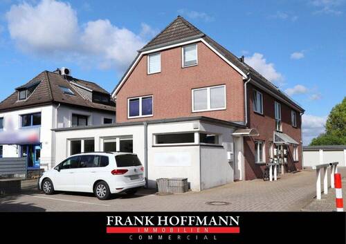 V10912a Titelbild - In zentraler Lage! Wohn- Geschäftshaus mit 5 Einheiten & 6 Garagen in Norderstedt