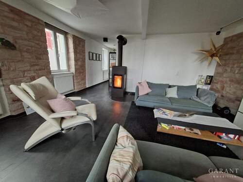 EG Wohnbereich mit Kaminofen - 6 Zimmer Etagenwohnung zum Kaufen in Heidelberg