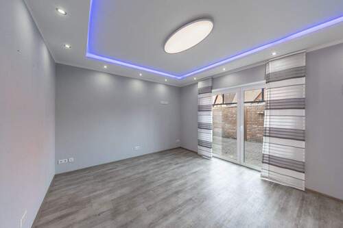 Das Wohnzimmer mit Terrassenzugang - Einfamilienhaus mit 106,70 m&sup2; in Löningen zum Kaufen