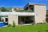 Rückseite mit Balkon und Terrasse - 