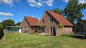 Blick aus dem Garten - Einfamilienhaus mit 155,00 m² in Großefehn zum Kaufen