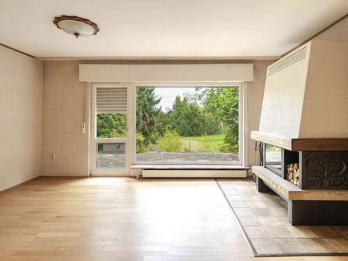 Wohnzimmer mit Kamin - Einfamilienhaus mit 191,00 m&sup2; in Berlin zum Kaufen