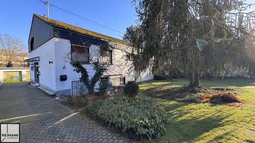 Außenansicht - Freistehendes Einfamilienhaus mit Einliegerwohnung, Doppelgarage und parkähnlichem Garten