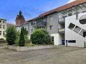 Ansicht Wohnanlage Innenhof - Etagenwohnung mit 71,50 m² in Delitzsch zum Kaufen