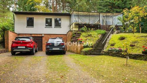 Außenansicht 1 - Traumhaft wohnen am See: Idyllisches Einfamilienhaus mit 5 Zimmern und großem Grundstück