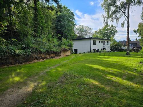 Maison Immobilien Bungalow Buchholz Ansicht Seite Eingang - 