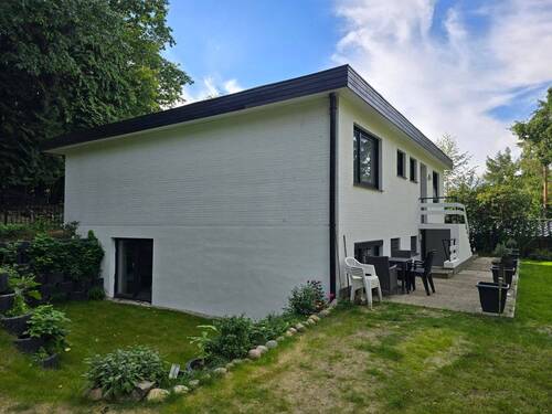 Maison Immobilien Bungalow Buchholz Ansicht UG Terrasse Eingang - 