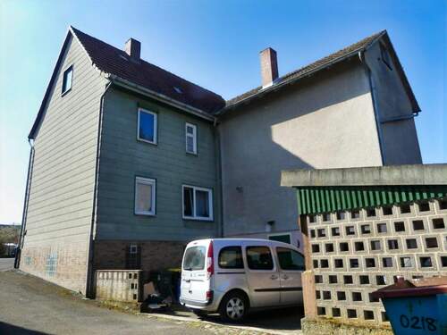 Rückseite mit Zufahrt zur Garage und Carport - Einfamilienhaus mit 186,00 m² in Espenau zum Kaufen