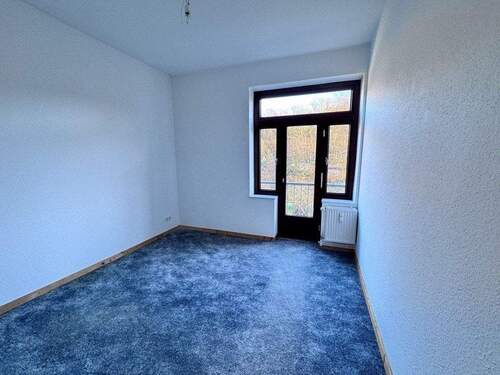 Wohnzimmer mit französischem Balkon - 3 Zimmer Etagenwohnung in Flensburg