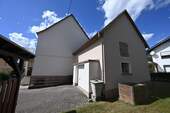 Nebengebäude mit Garage - Einfamilienhaus mit 132,80 m² in Girod zum Kaufen