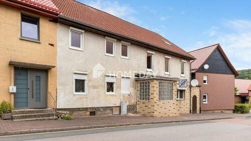 Außenansicht 3 - 1 Zimmer Mehrfamilienhaus, Wohnhaus zum Kaufen in Delligsen
