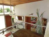 Blick zum Eingang und Wohnzimmer - 