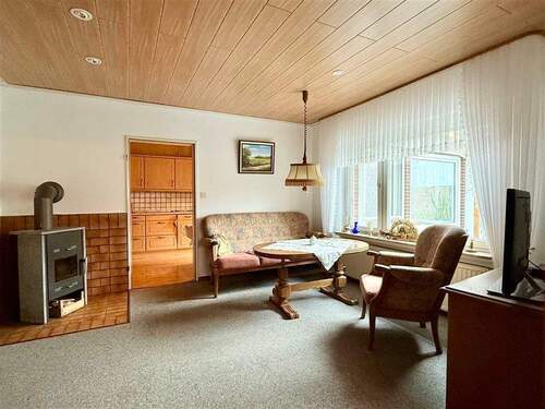 Kaminzimmer - Mehrfamilienhaus, Wohnhaus mit 137,00 m&sup2; in Südbrookmerland zum Kaufen