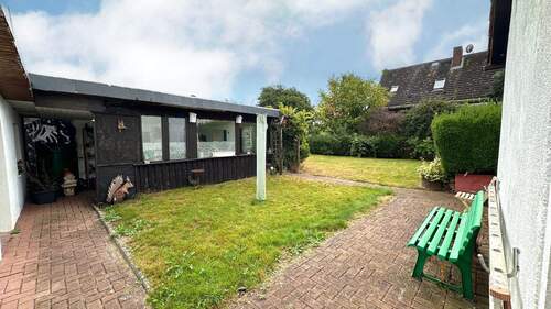 Gartenbereich mit geschützem Sitzbereich - Einfamilienhaus mit 110,00 m² in Hänigsen zum Kaufen