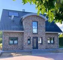 K 585: Junges Einfamilienhaus mit großzügiger Raumaufteilung und Doppelgarage in ruhiger Lage von Lünne!