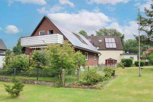 Titelbild - Wohnen & Vermieten in Hiddenhausen - gepflegtes Wohnhaus mit vermietetem Dorfgrill