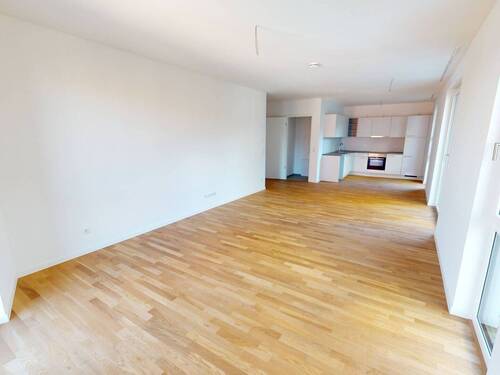 Ansicht I: Wohnzimmer mit offenem Küchenbereich - Komfort pur: Große 2-Zimmer-Wohnung mit moderner Ausstattung und 2 Balkone!