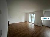 Ansicht III: Wohn- und Esszimmer mit offenem Küchenbereich - 