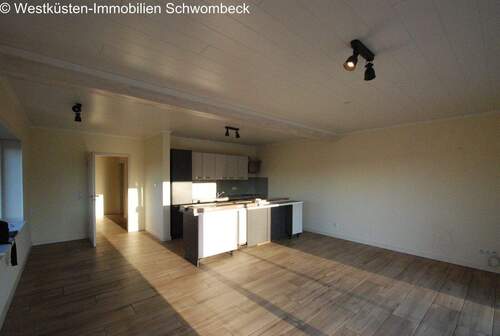 Wohnzimmer mit Küche - 2 Zimmer Terrassenwohnung in Hemme