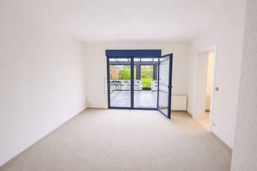 Helles Wohnzimmer zum Wintergarten - Mehrfamilienhaus, Wohnhaus mit 100,00 m&sup2; in Meerbusch zum Kaufen