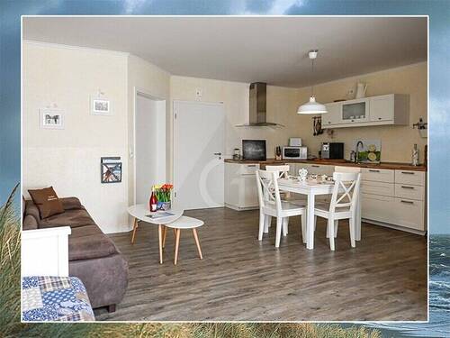 Wohnzimmer mit offener Küche - 2 Zimmer Etagenwohnung zum Kaufen in Dornum-Westdorf