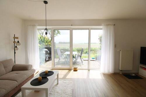 Blick auf die Terrasse - Reihenmittelhaus mit 83,10 m&sup2; in Friedrichskoog zum Kaufen