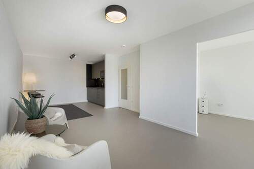 Wohnbereich - Modern sanierte 2-Zimmer-Wohnung mit Weitblick und Tiefgaragenstellplatz auf St. Pauli - Erstbezug!