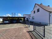 Straßenansicht mit Carport - Einfamilienhaus mit 180,00 m&sup2; in Delitzsch zum Kaufen