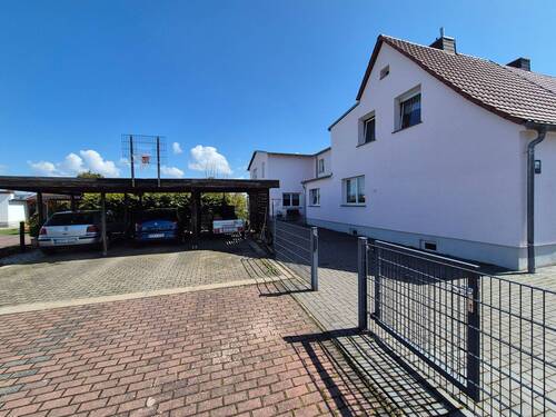 Straßenansicht mit Carport - Einfamilienhaus mit 180,00 m&sup2; in Delitzsch zum Kaufen
