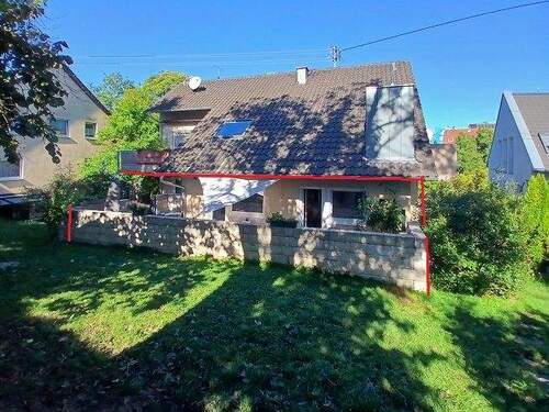 Ansicht 1 - Außergewöhnliches Wohnambiente! Terrassenwohnung in Dreifamilienhaus mit Doppelgarage!