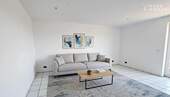 Wohnzimmer - Charmante 3-Zimmer-Wohnung mit sonnigem Balkon und TG-Stellplatz