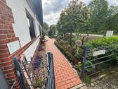 Ansicht Süden Hauseingang + Strasse - 1 Zimmer Einfamilienhaus zum Kaufen in Wagenfeld