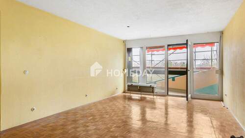 Wohnzimmer 1 - Großzügige 4-Zimmer-Wohnung mit Loggia und Aufzug in Wörth am Rhein