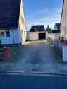 Grundstückszufahrt mit Doppelgarage - 6 Zimmer Einfamilienhaus zum Kaufen in Soltau