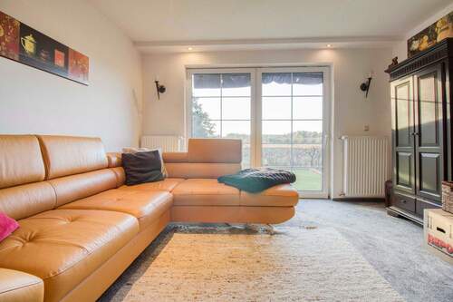 Wohnzimmer - 9 Zimmer Einfamilienhaus zum Kaufen in Vogelsang-Warsin