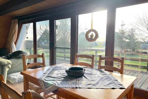 Wohn- und Esszimmer mit Ausgang auf die Terrasse - Mehrfamilienhaus, Wohnhaus in Butjadingen zum Kaufen