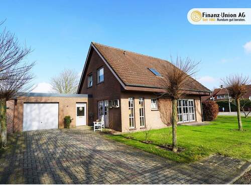 Außenansicht mit Logo - Wohnen in Emlichheim: Liebevoll gepflegtes Einfamilienhaus mit schönem Garten!