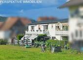 Bild 1 - Vermietetes Mehrfamilienhaus + Baugrundstück und Garagen