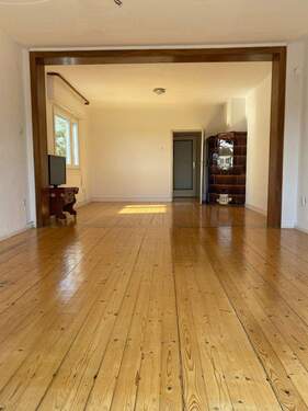 Wohnzimmer EG mit Kachelofen - 