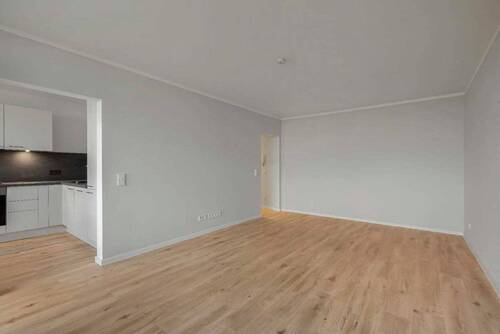 Wohnzimmer - Modern sanierte 2-Zimmer-Wohnung mit Loggia und Tiefgaragenstellplatz