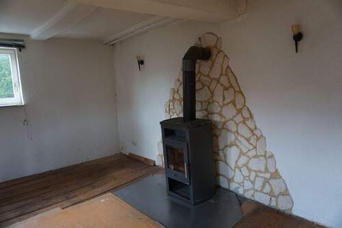 Ofen Wohnzimmer EG.JPG - Mehrfamilienhaus, Wohnhaus mit 179,60 m&sup2; in Homberg zum Kaufen