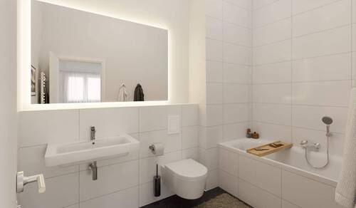 Ein modern gefliestes Badezimmer, inklusive Wanne - 