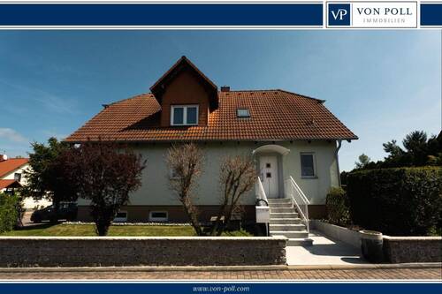 Titelbild - Elegantes Einfamilienhaus mit viel Platz und traumhaftem Garten - Idylle trifft Qualität
