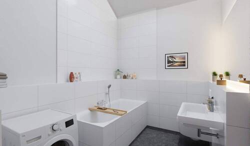 Ein modern gefliestes Badezimmer, inklusive Wanne - 