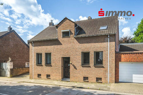 Titelbild mit Logo - Eine Immobilie - viele Möglichkeiten! Einfamilienhaus mit Garage und großem Garten in Horbach